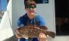 Josh with a nice snowy grouper caught deep dropping with New Lattitude Sportfishing.jpg